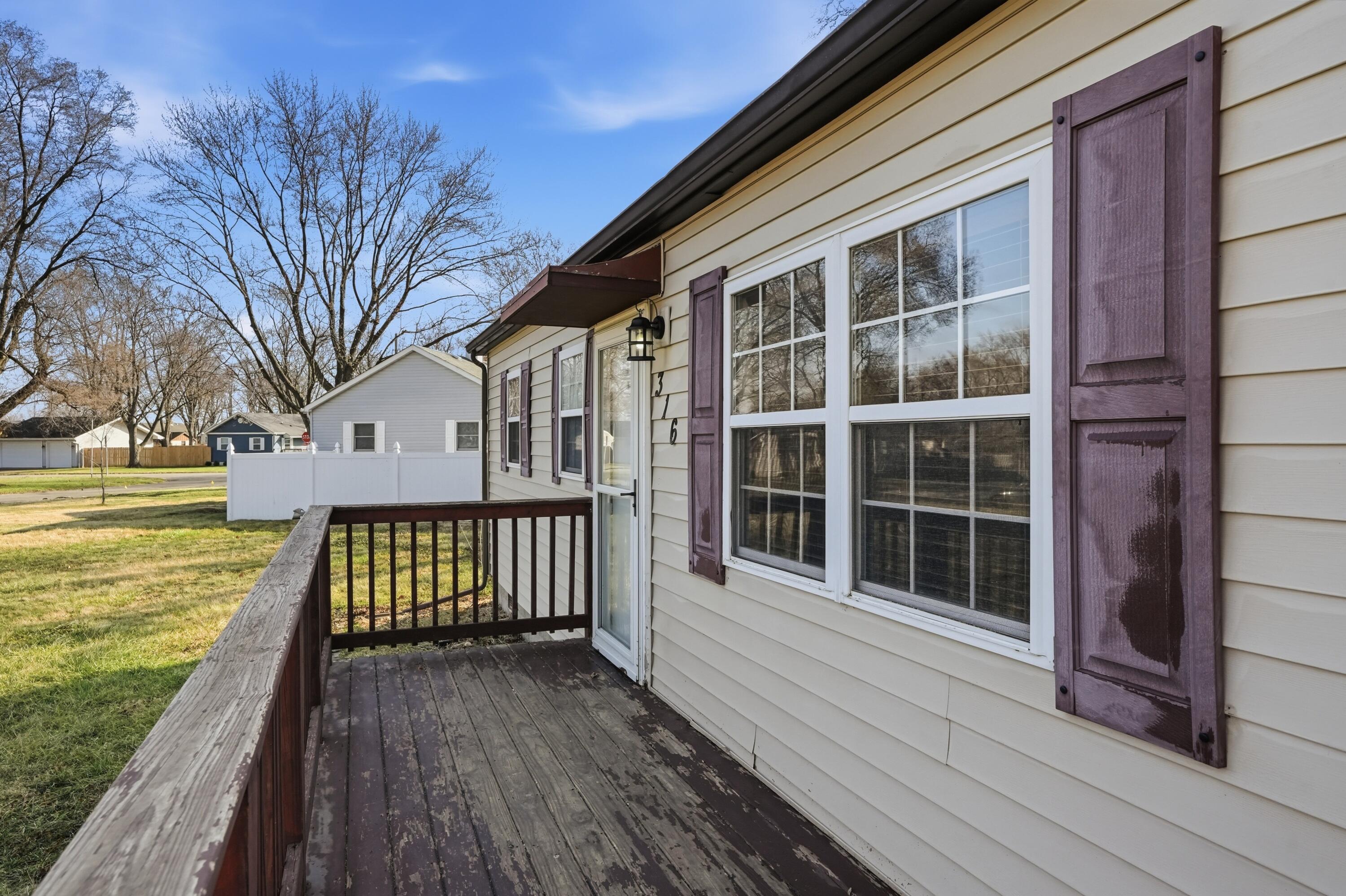 316 Oak Circle Crown Point, IN 46307 - Photo 3 of 19 a view of a house with a wooden deck