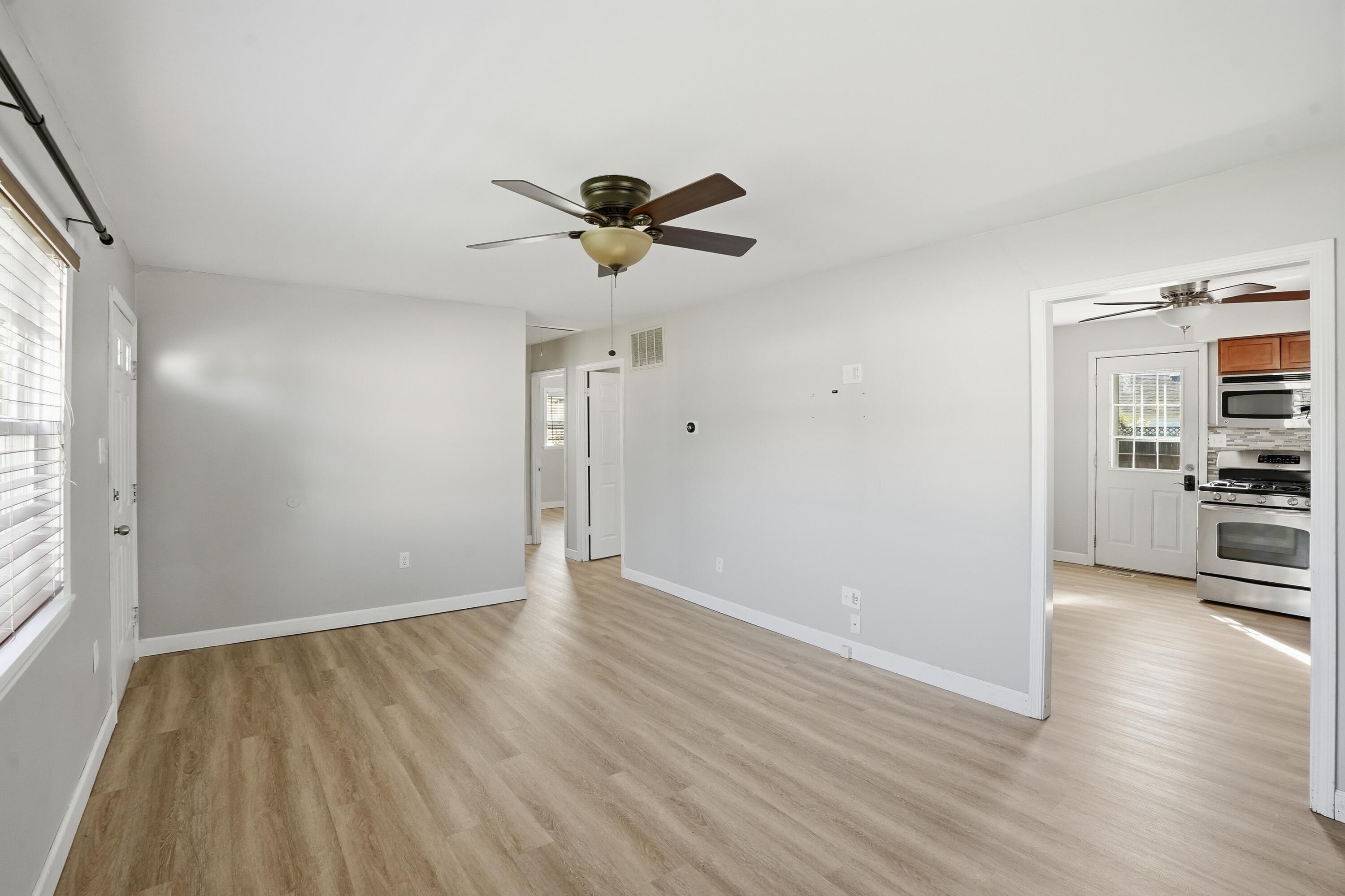 316 Oak Circle Crown Point, IN 46307 - Photo 5 of 19 a view of a room with wooden floor and ceiling fan