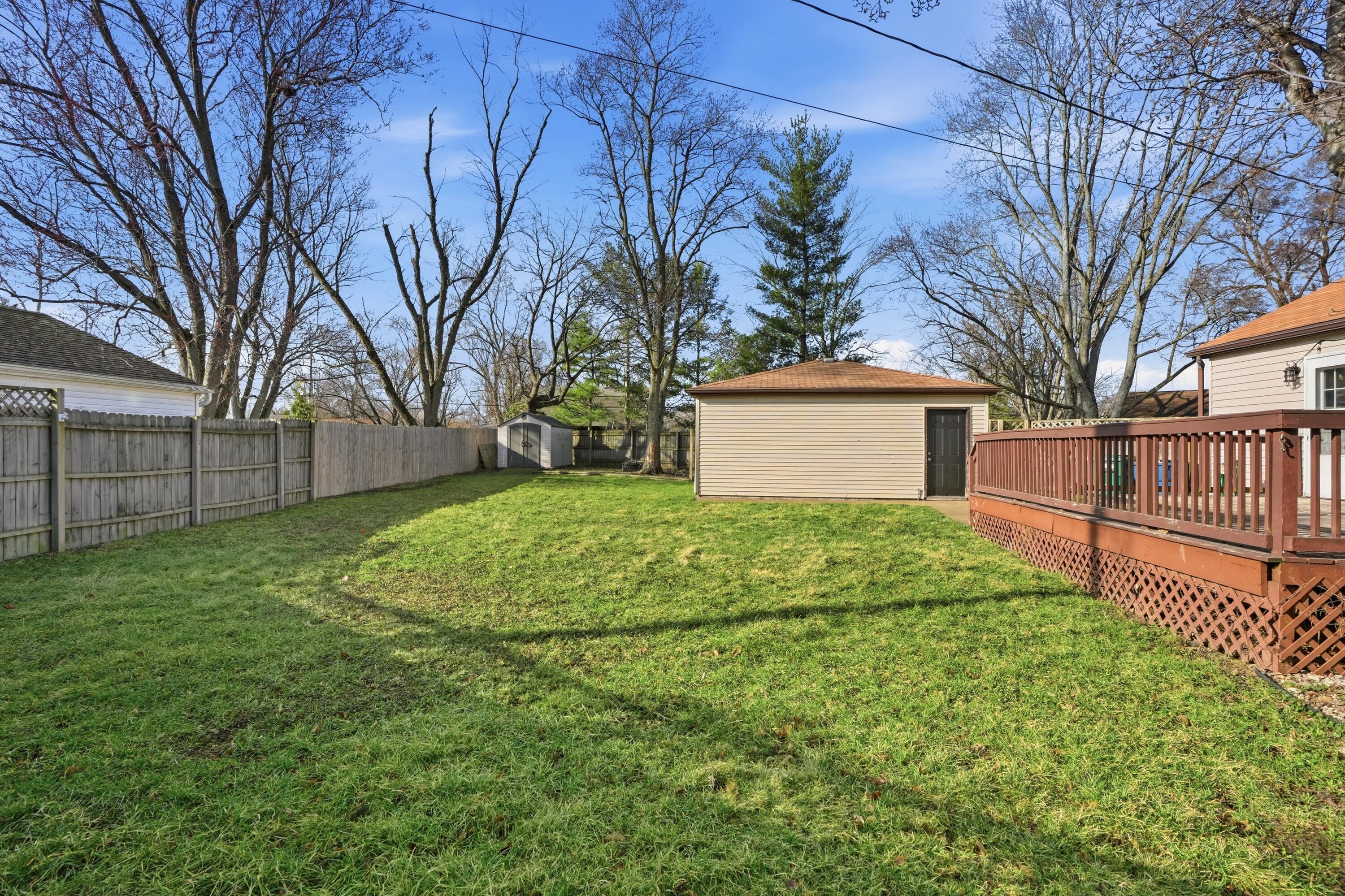 316 Oak Circle Crown Point, IN 46307 - Photo 5 of 19 a view of a backyard with a large tree