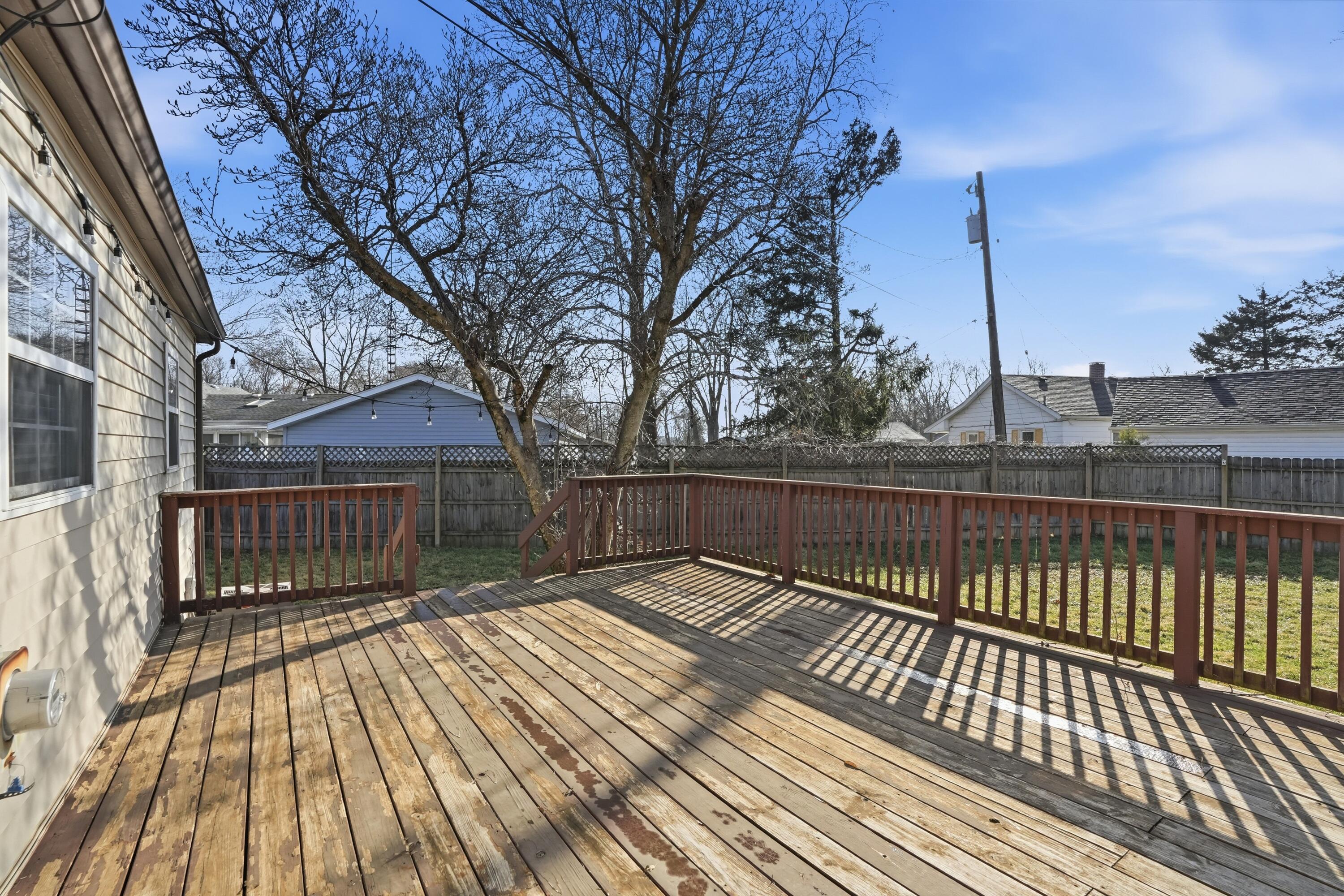 316 Oak Circle Crown Point, IN 46307 - Photo 8 of 19 a view of balcony with wooden floor and fence