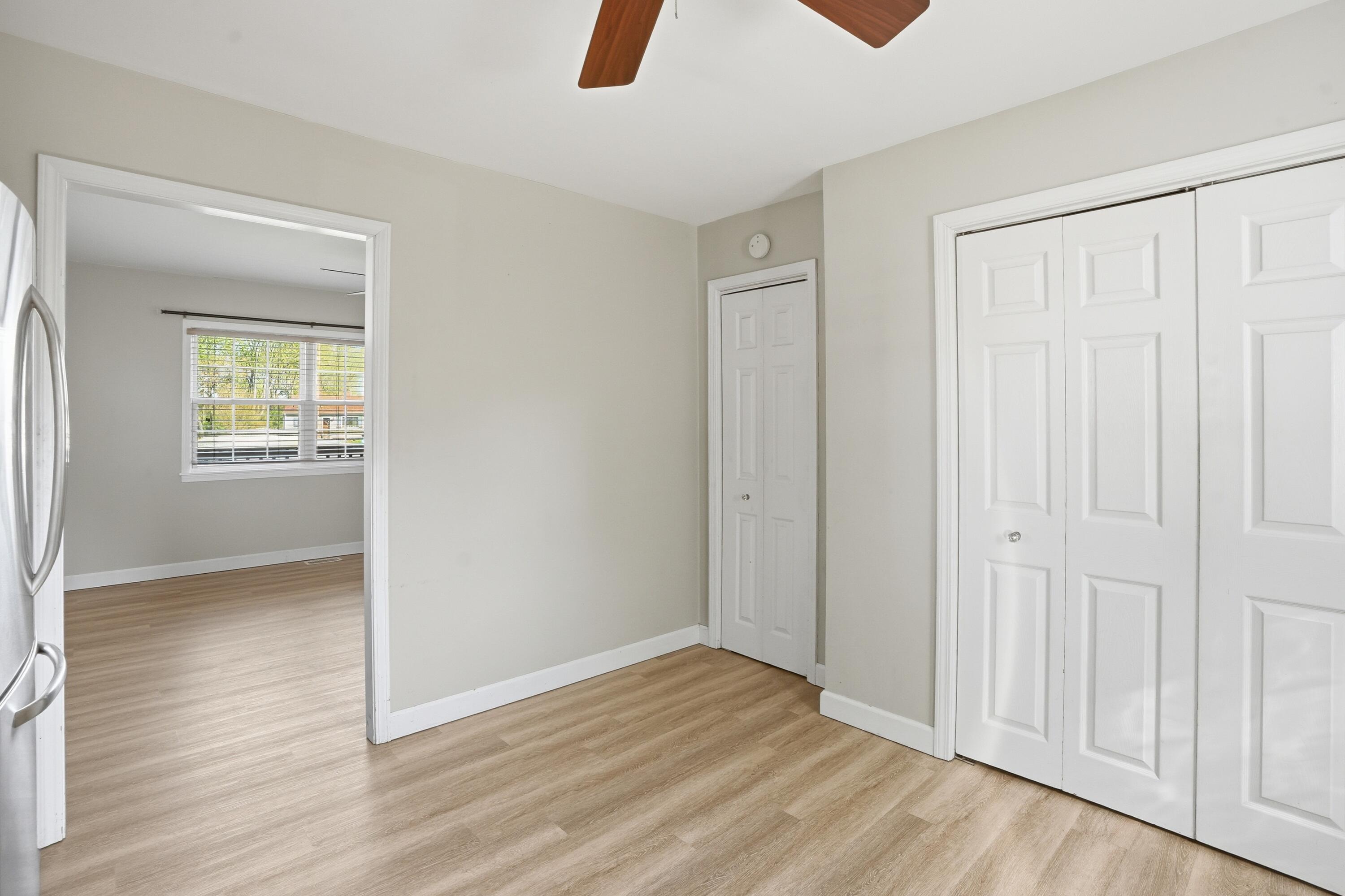 316 Oak Circle Crown Point, IN 46307 - Photo 8 of 19 an empty room with wooden floor and closet