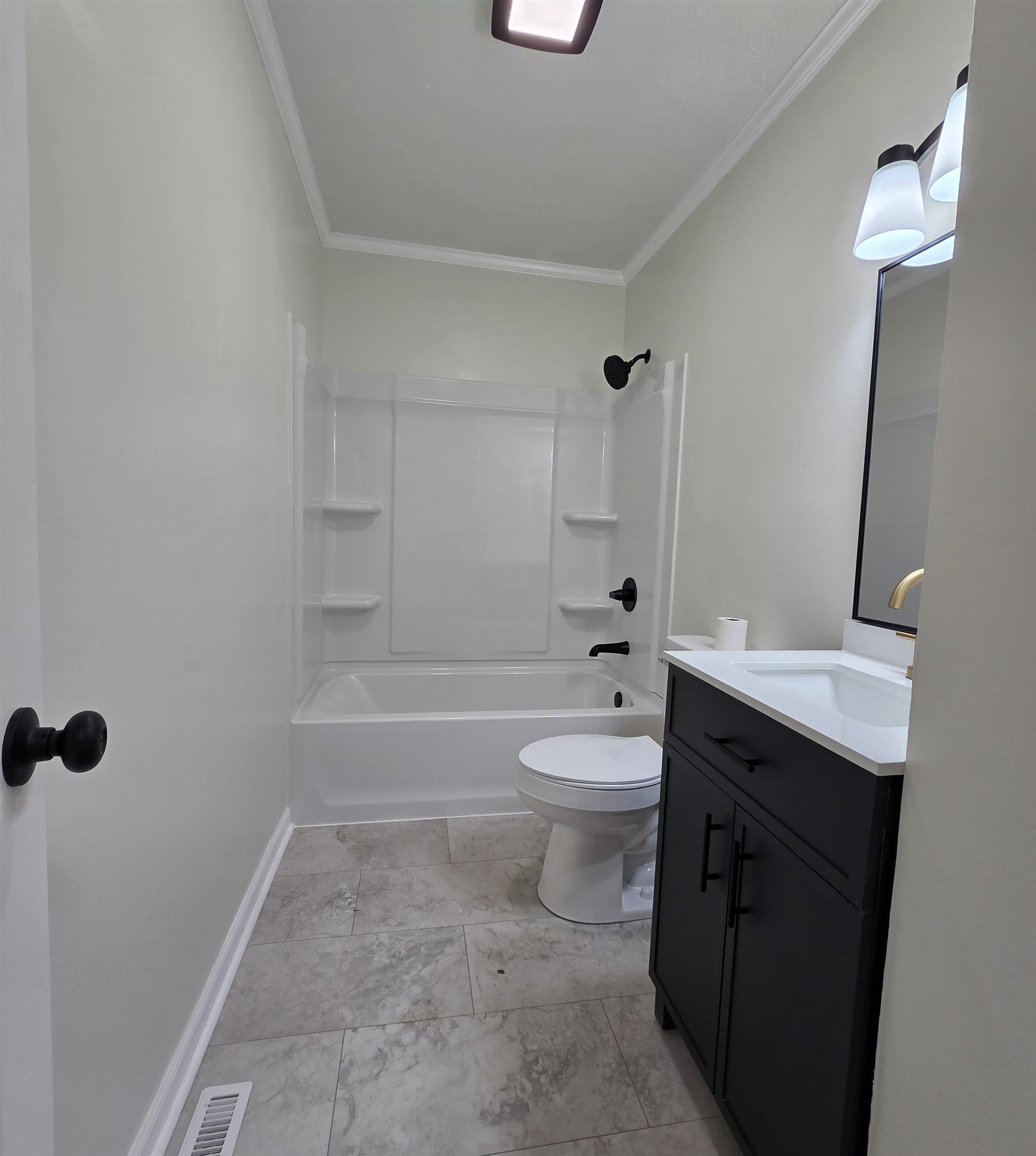 230 Dodge Street Stuarts Draft, VA 24477 - Photo 9 of 14 a bathroom with a toilet a sink and bathtub