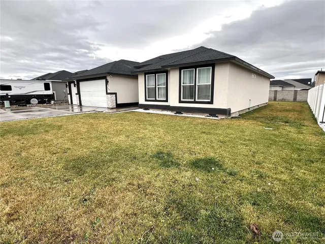 a house view with a garden space