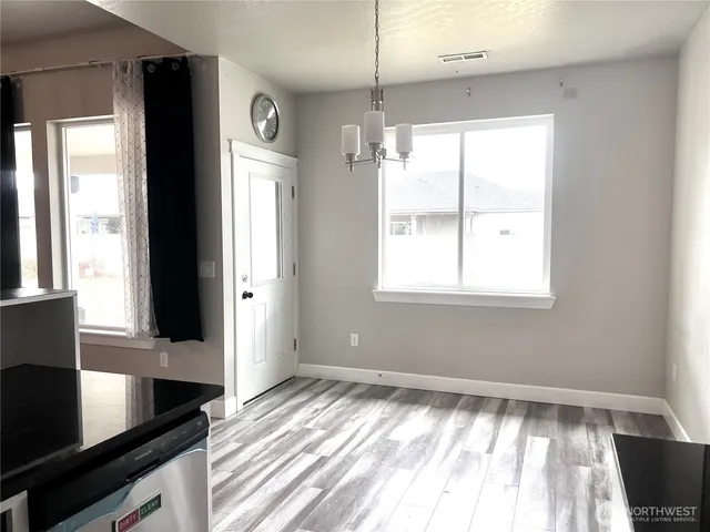 a view of a living room with a large window