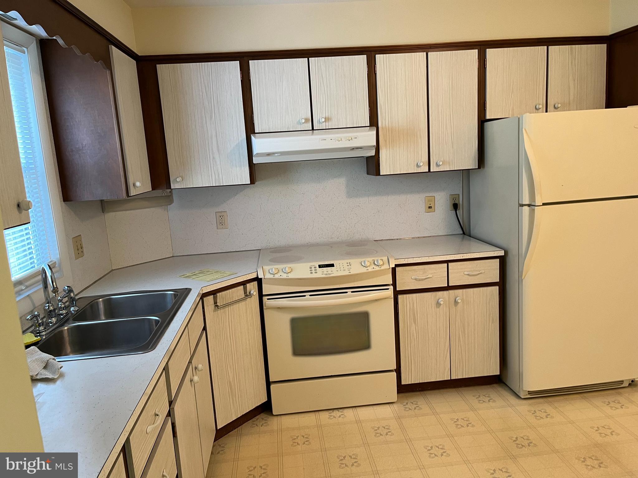 113 Gretchen Drive Reading, PA 19607 - Photo 5 of 6 a kitchen with stainless steel appliances a refrigerator sink and cabinets