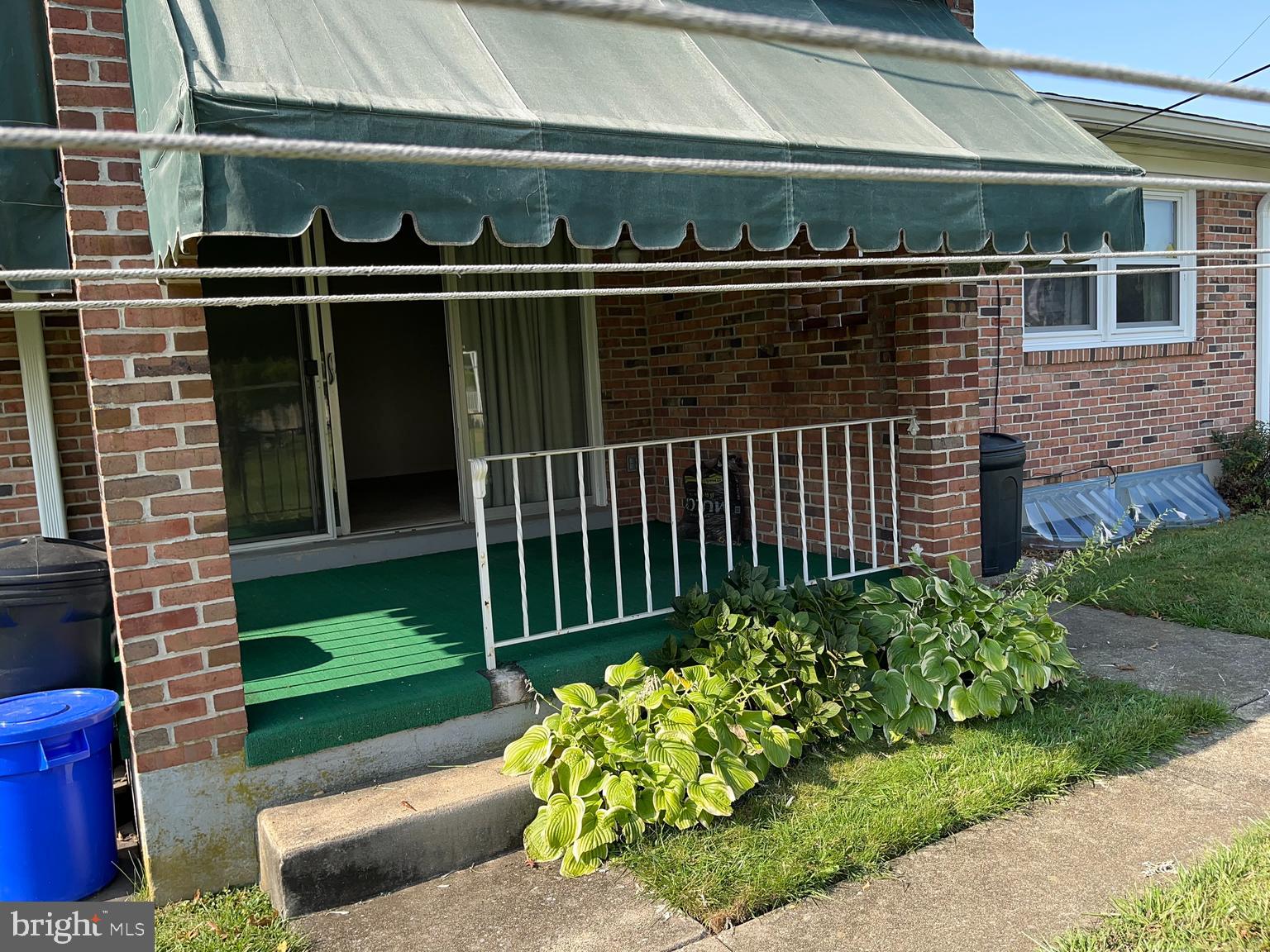 113 Gretchen Drive Reading, PA 19607 - Photo 6 of 6 a view of a porch with a bench