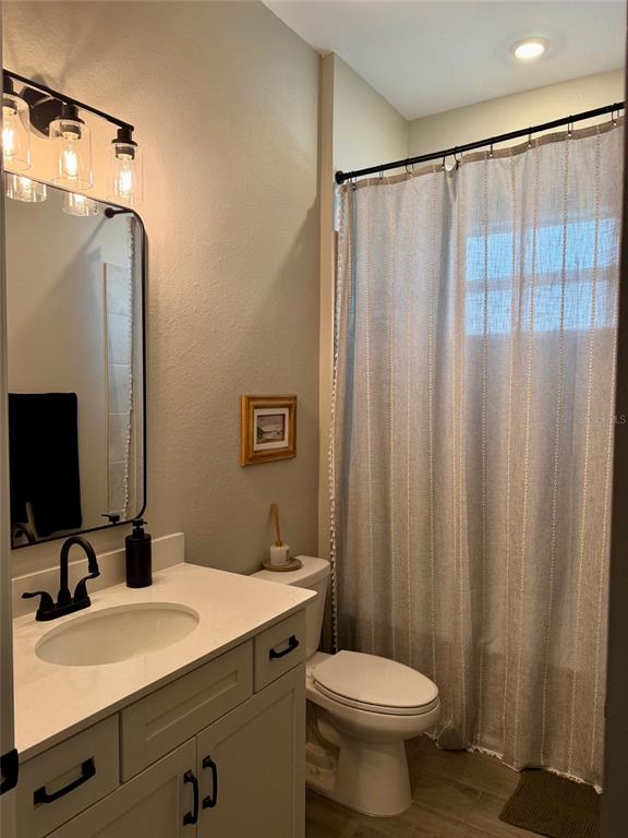 17577 Santorini Court Venice, FL 34293 - Photo 15 of 54 a bathroom with a sink a toilet and shower
