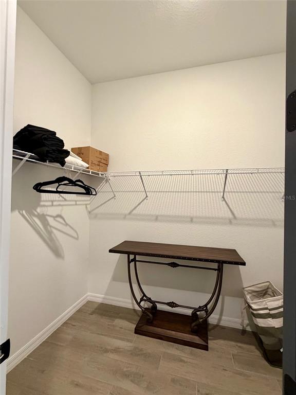17577 Santorini Court Venice, FL 34293 - Photo 19 of 54 a view of a room with gym equipment