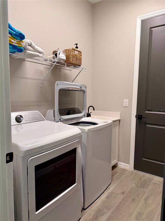 17577 Santorini Court Venice, FL 34293 - Photo 20 of 54 a utility room with washer and dryer
