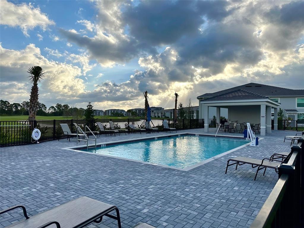 17577 Santorini Court Venice, FL 34293 - Photo 29 of 54 a view of a house with swimming pool and sitting area