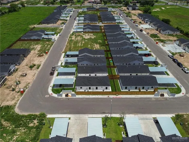 an aerial view of a large building with swimming pool
