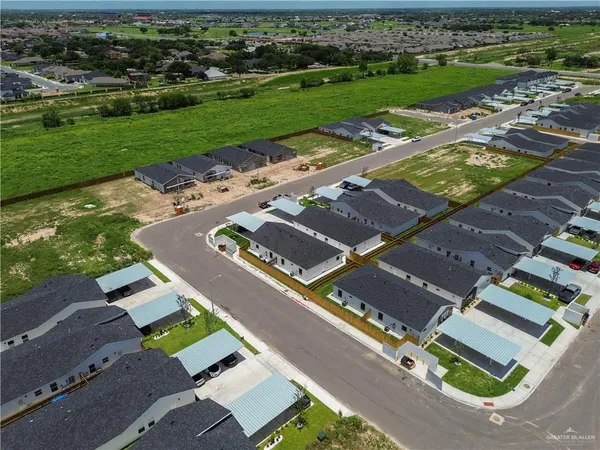 an aerial view of a house with a garden