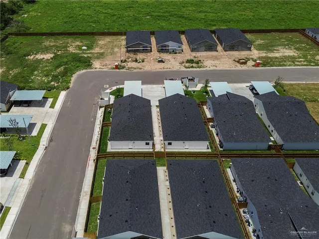 an aerial view of a house with swimming pool