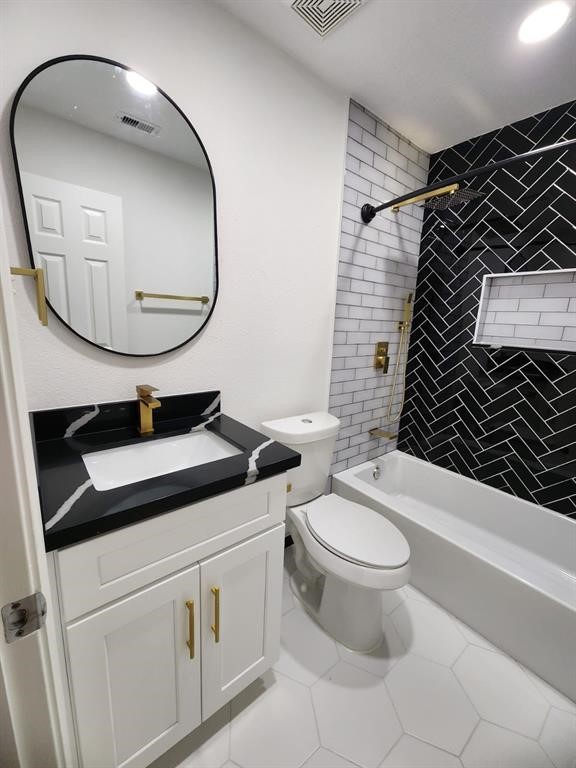 206 Doncaster Conroe, TX 77303 - Photo 23 of 28 a bathroom with a toilet a sink and a mirror