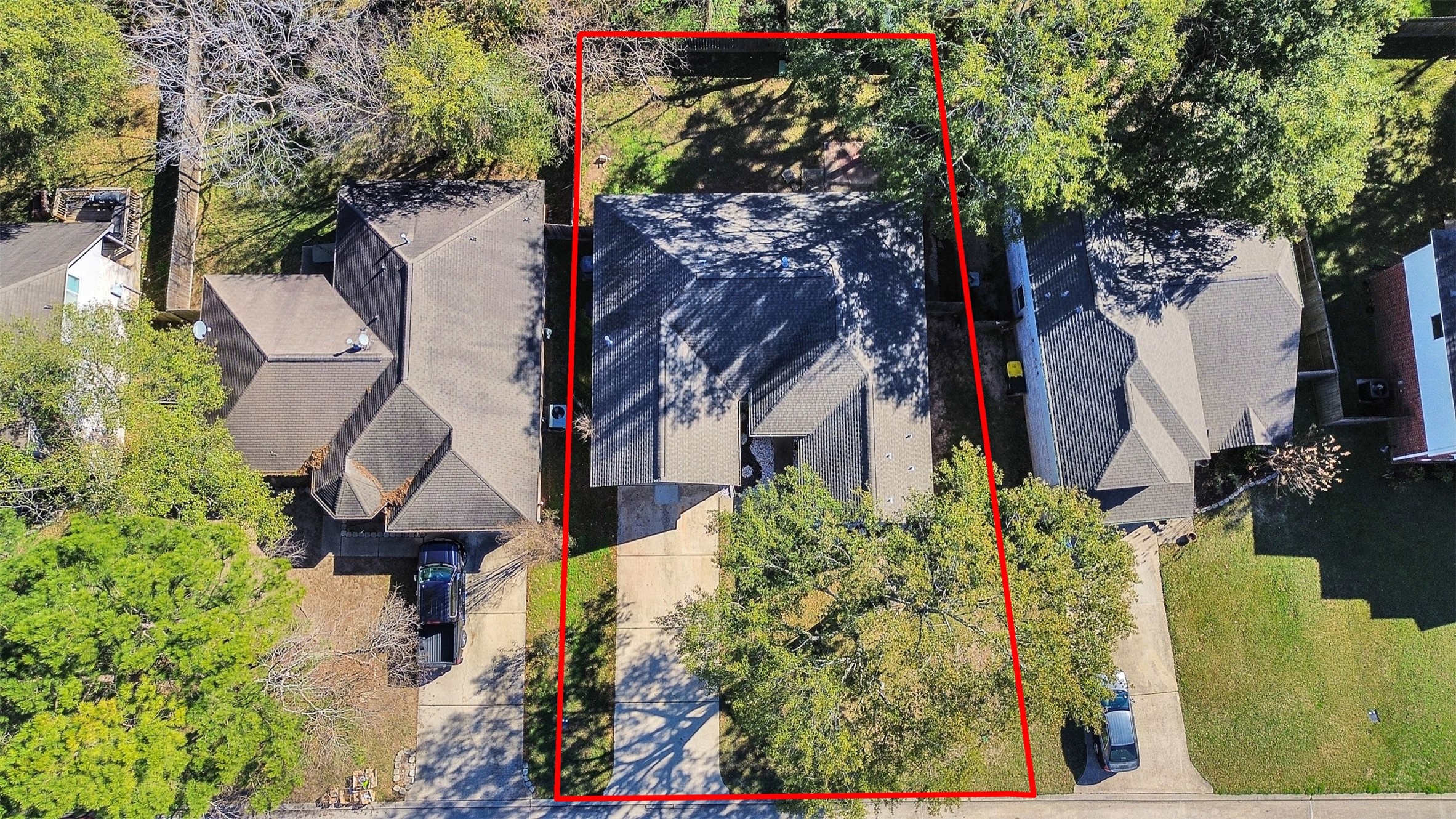 206 Doncaster Conroe, TX 77303 - Photo 36 of 38 an aerial view of residential house with outdoor space and trees all around