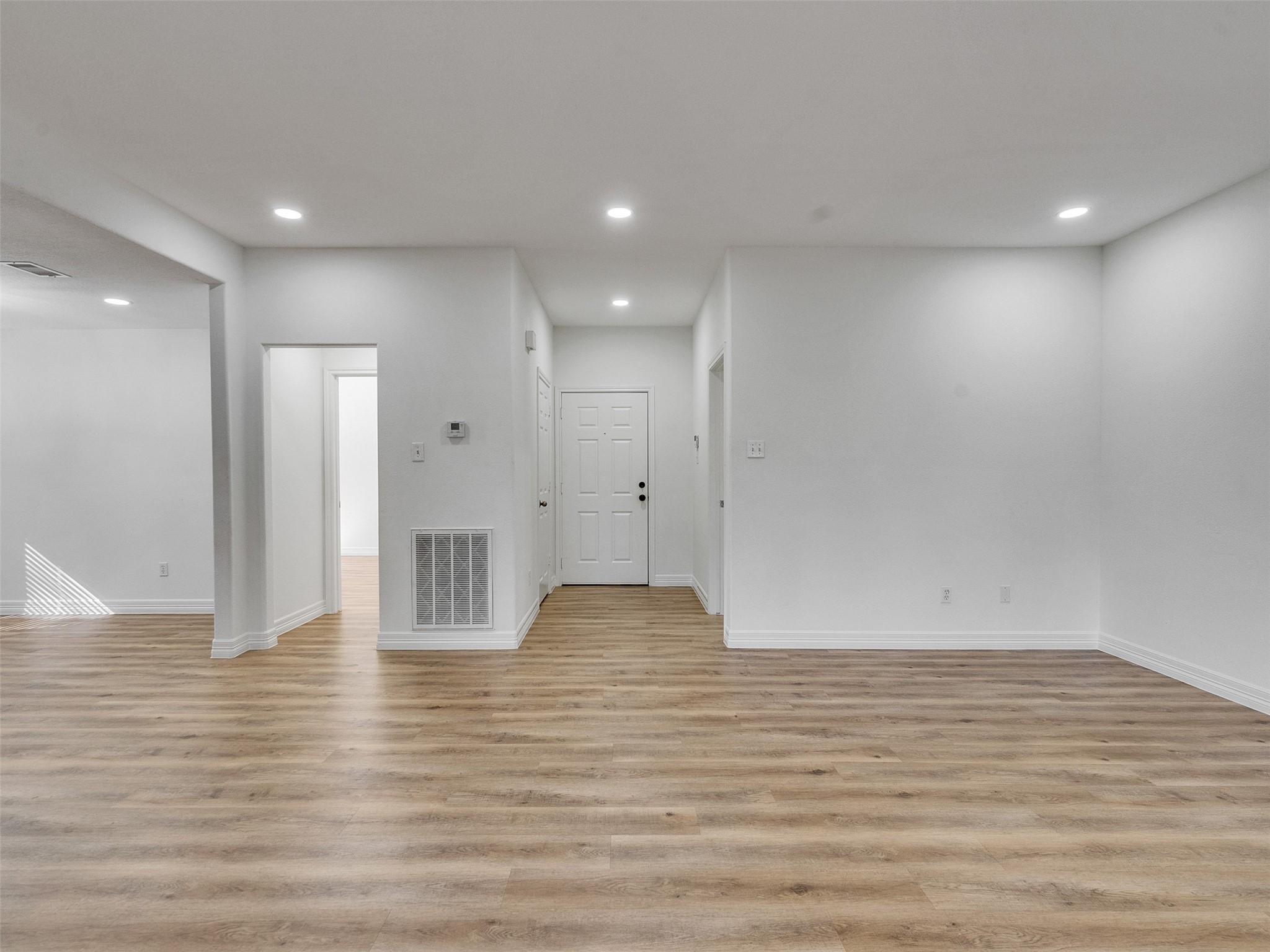 206 Doncaster Conroe, TX 77303 - Photo 9 of 38 a view of an empty room with wooden floor