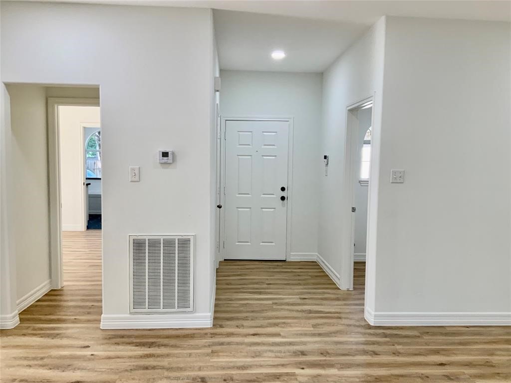 206 Doncaster Conroe, TX 77303 - Photo 10 of 28 a view of a livingroom with wooden floor
