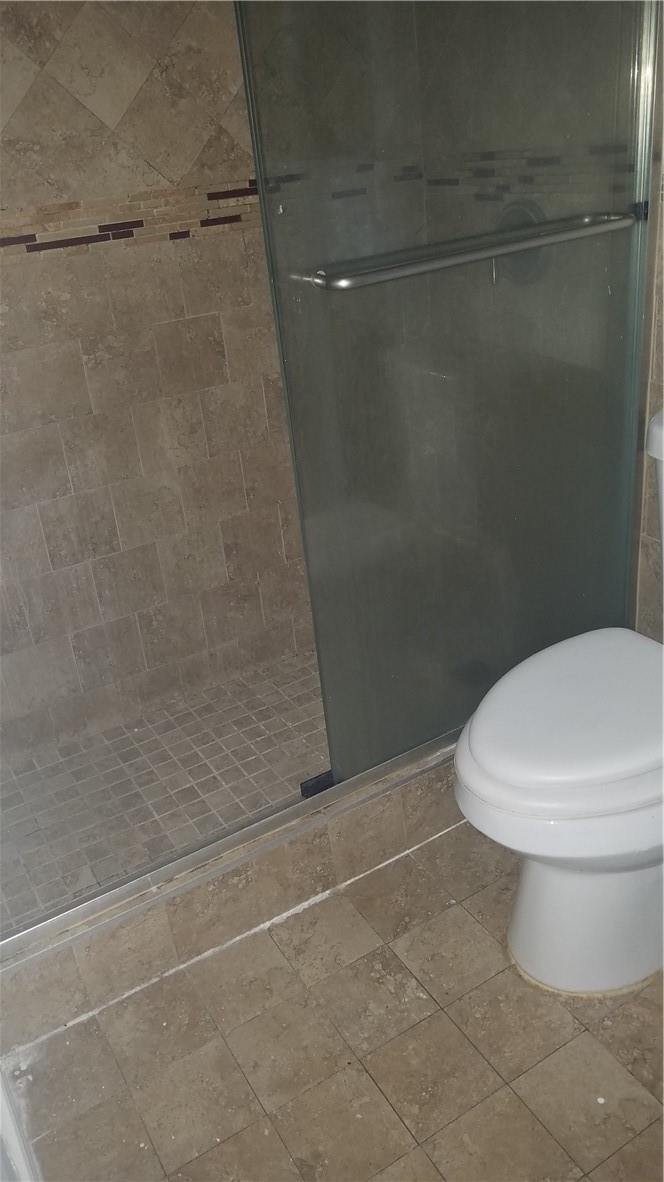 1300 West 53rd Street, Unit 7 Hialeah, FL 33012 - Photo 12 of 22 a bathroom with a toilet and a shower