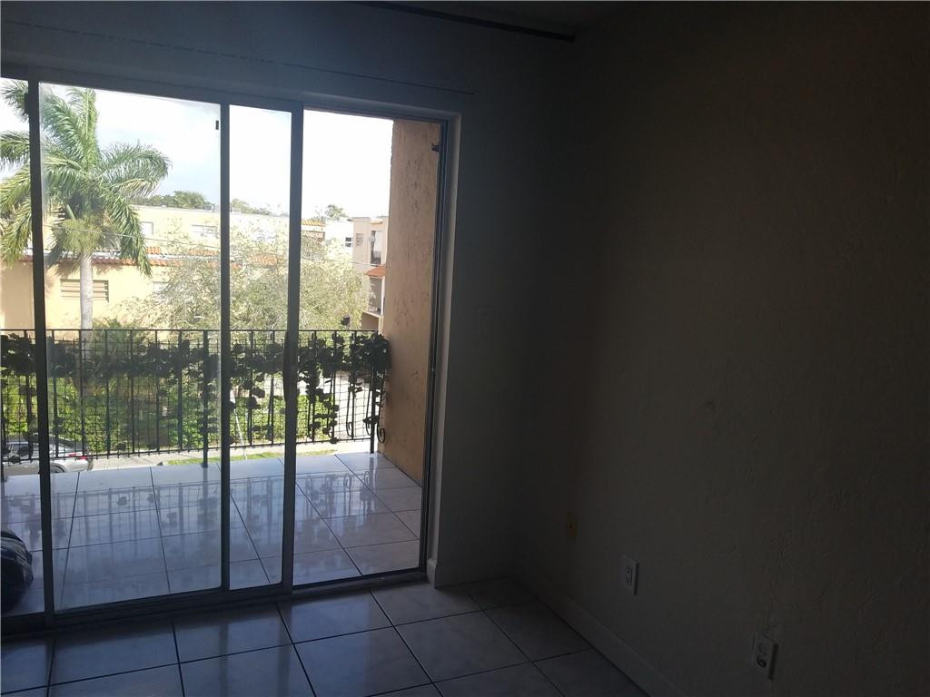 1300 West 53rd Street, Unit 7 Hialeah, FL 33012 - Photo 16 of 22 a view of a glass door