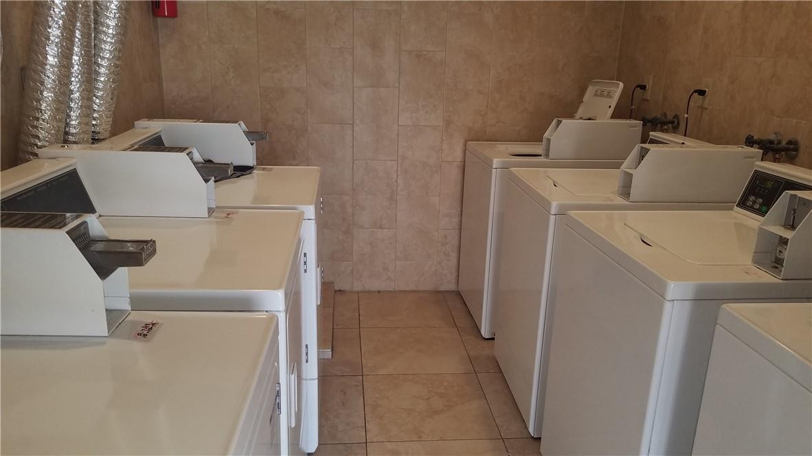1300 West 53rd Street, Unit 7 Hialeah, FL 33012 - Photo 22 of 22 a utility room with dryer and washer