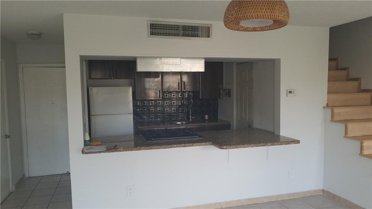 1300 West 53rd Street, Unit 7 Hialeah, FL 33012 - Photo 3 of 22 a room with fireplace