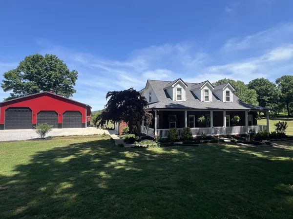 a view of a house with a yard and plants