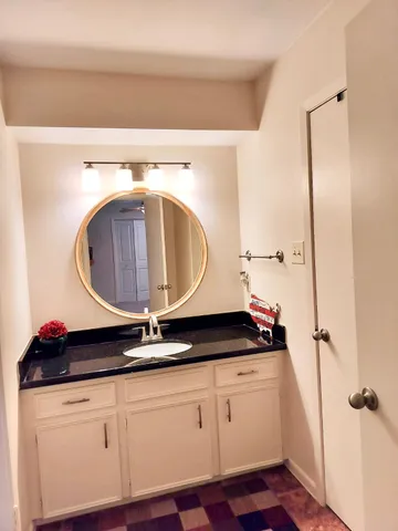 a close view of a sink a washer and dryer