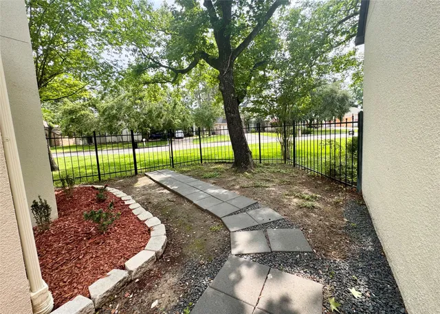 a view of a backyard of the house