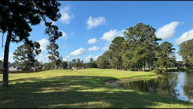 a view of a lake with a big yard