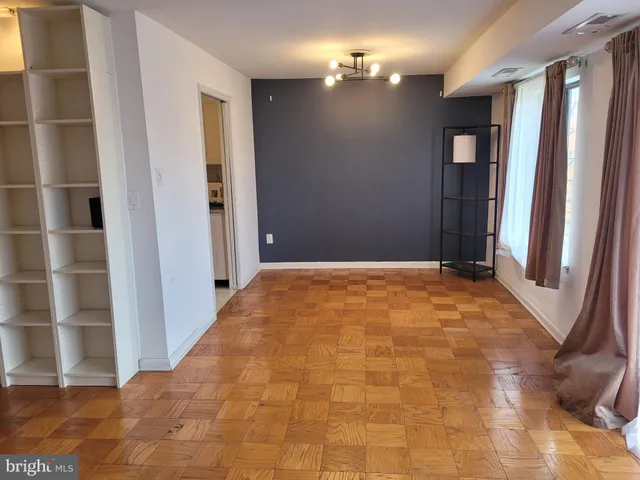 a view of an empty room with a window