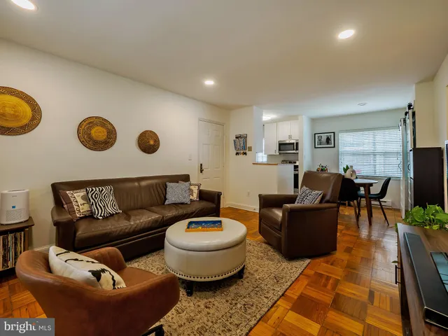 a living room with furniture and a table