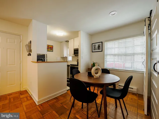 a view of a dining room with furniture and window