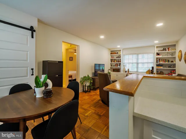 a kitchen with a table and chairs in it