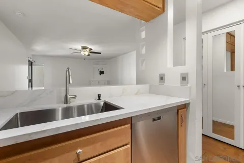 a kitchen with a sink and a refrigerator