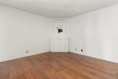 a view of empty room with ceiling fan