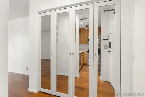 a bathroom with a glass shower door and a glass door