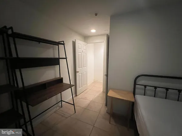 a view of room with stairs and wooden floor