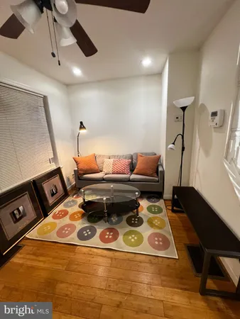 a living room with a table and chairs