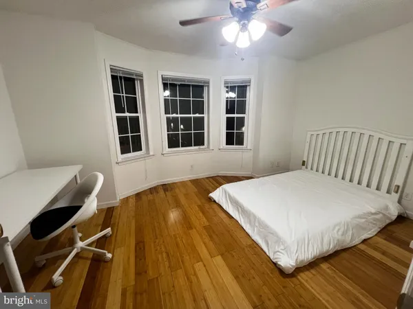 a view of a livingroom with furniture and an empty room