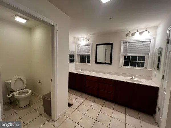 a bedroom with a bed and a chair
