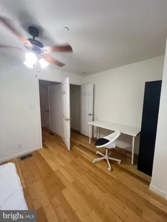 a spacious bathroom with a tub shower and a sink