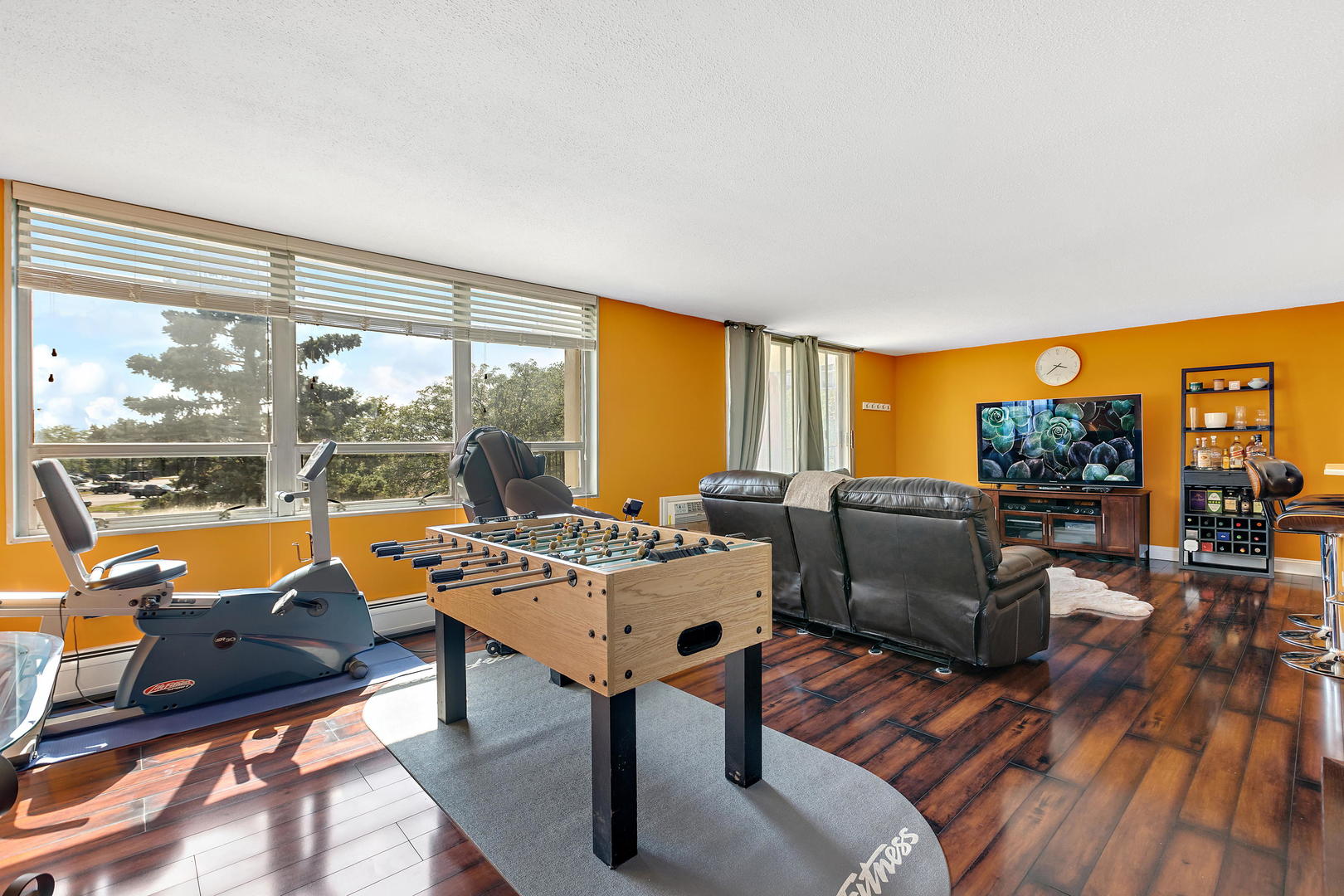 8801 West Golf Road, Unit 3B Niles, IL 60714 - Photo 7 of 17 a living room with furniture and a floor to ceiling window
