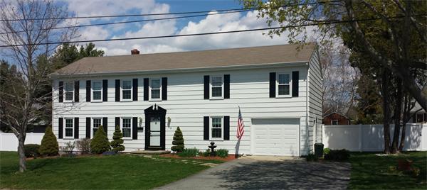 78 Riley Avenue Somerset, MA 02726 - Photo 2 of 2 a front view of a house with a yard and trees