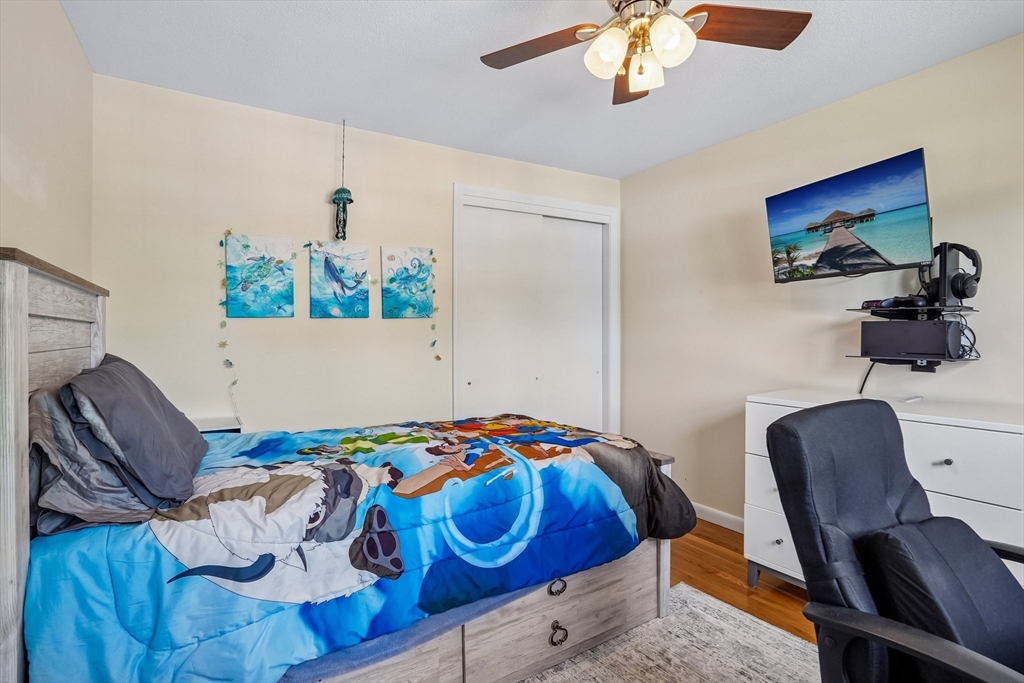 35 Westgate Road Framingham, MA 01701 - Photo 27 of 37 a bedroom with a bed and a chair