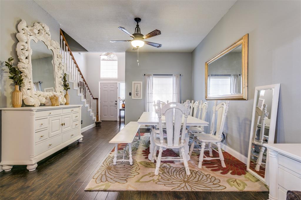 2133 Rim Rock Drive Keller, TX 76248 - Photo 7 of 37 Dining room featuring dark wood-type flooring, stairway, and a ceiling fan