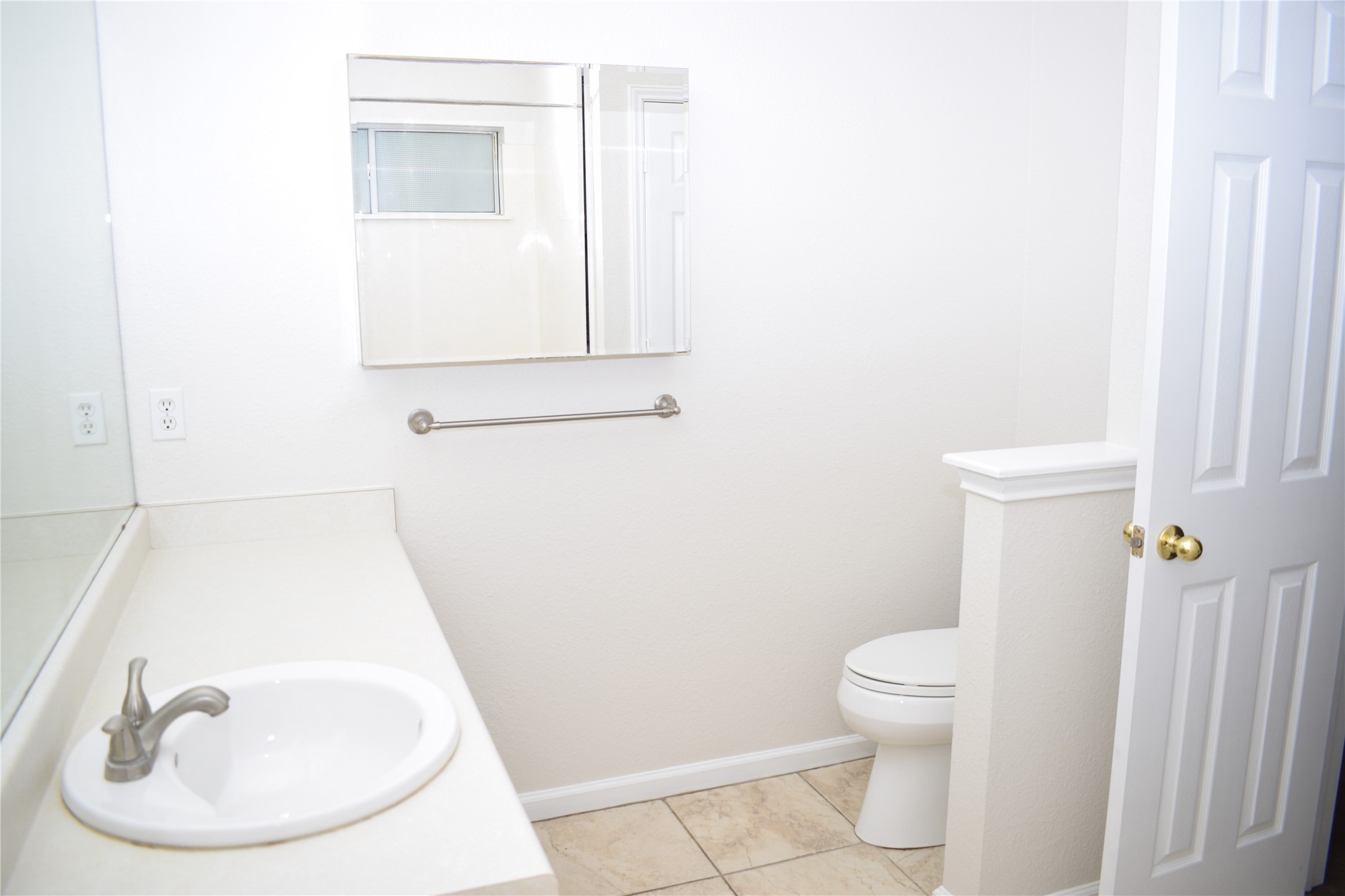 3209 Port Anne Way Leander, TX 78641 - Photo 13 of 30 Bathroom featuring a vanity with an integrated sink, brushed nickel faucet, and a wall-mounted medicine cabinet