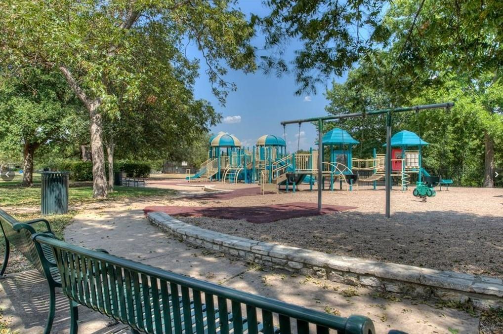 3209 Port Anne Way Leander, TX 78641 - Photo 25 of 30 Expansive playground featuring multiple play structures, swings, and climbing elements