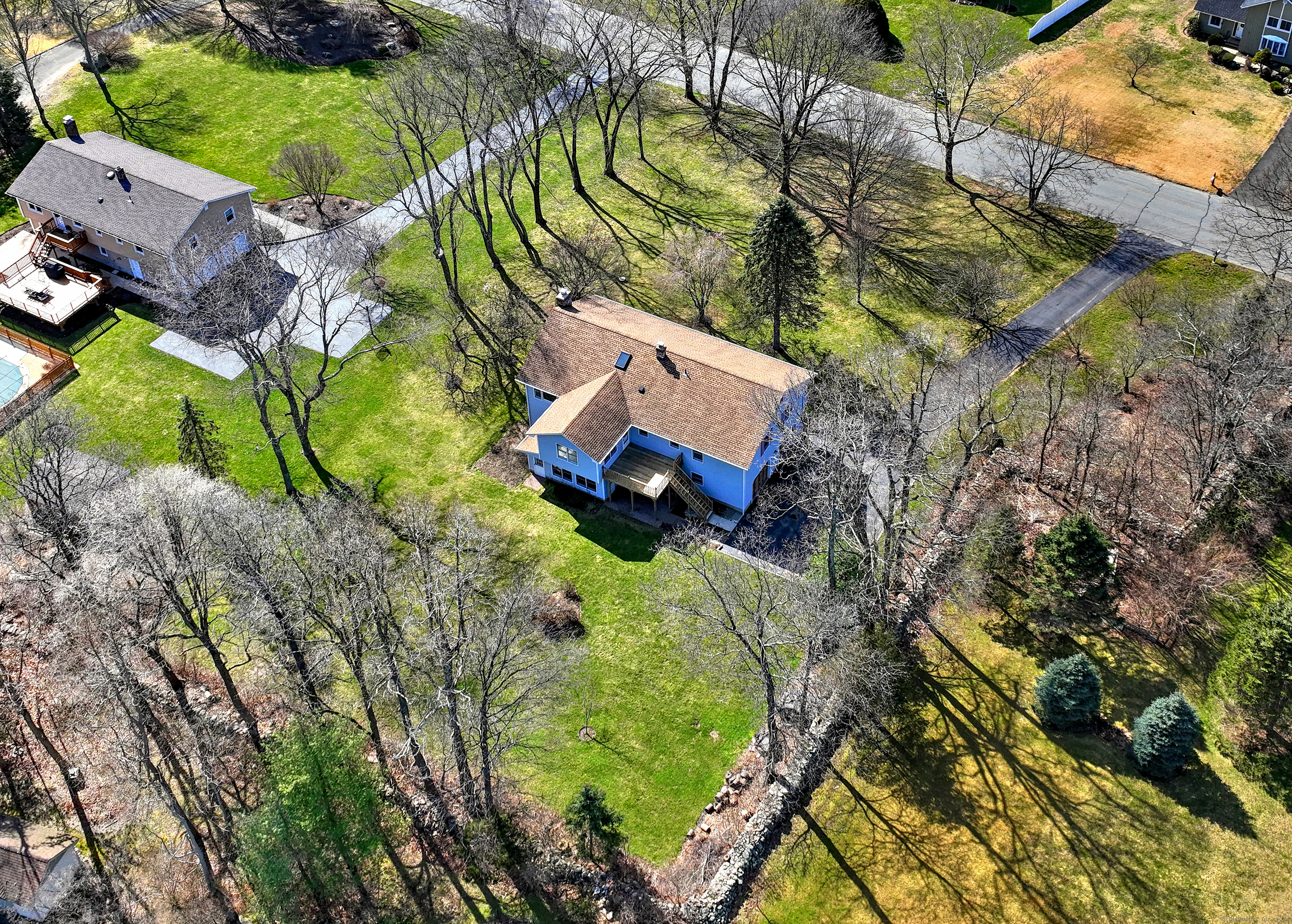 aerial view of a house with a yard