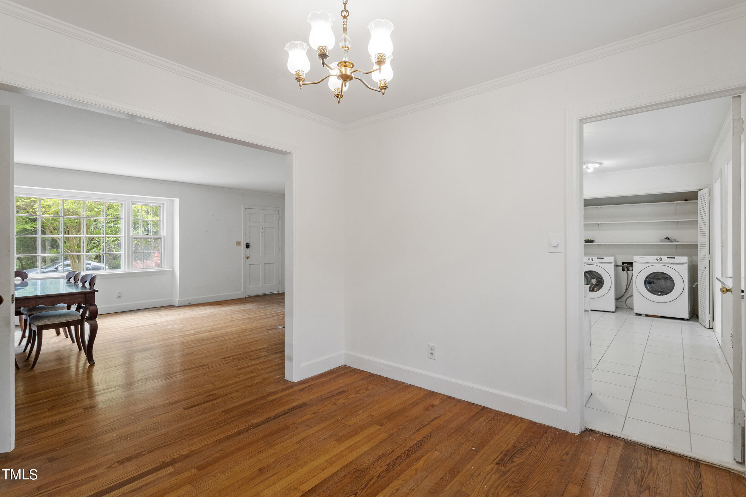611 Beaver Dam Road Raleigh, NC 27607 - Photo 10 of 36 wooden floor in an empty room with a window