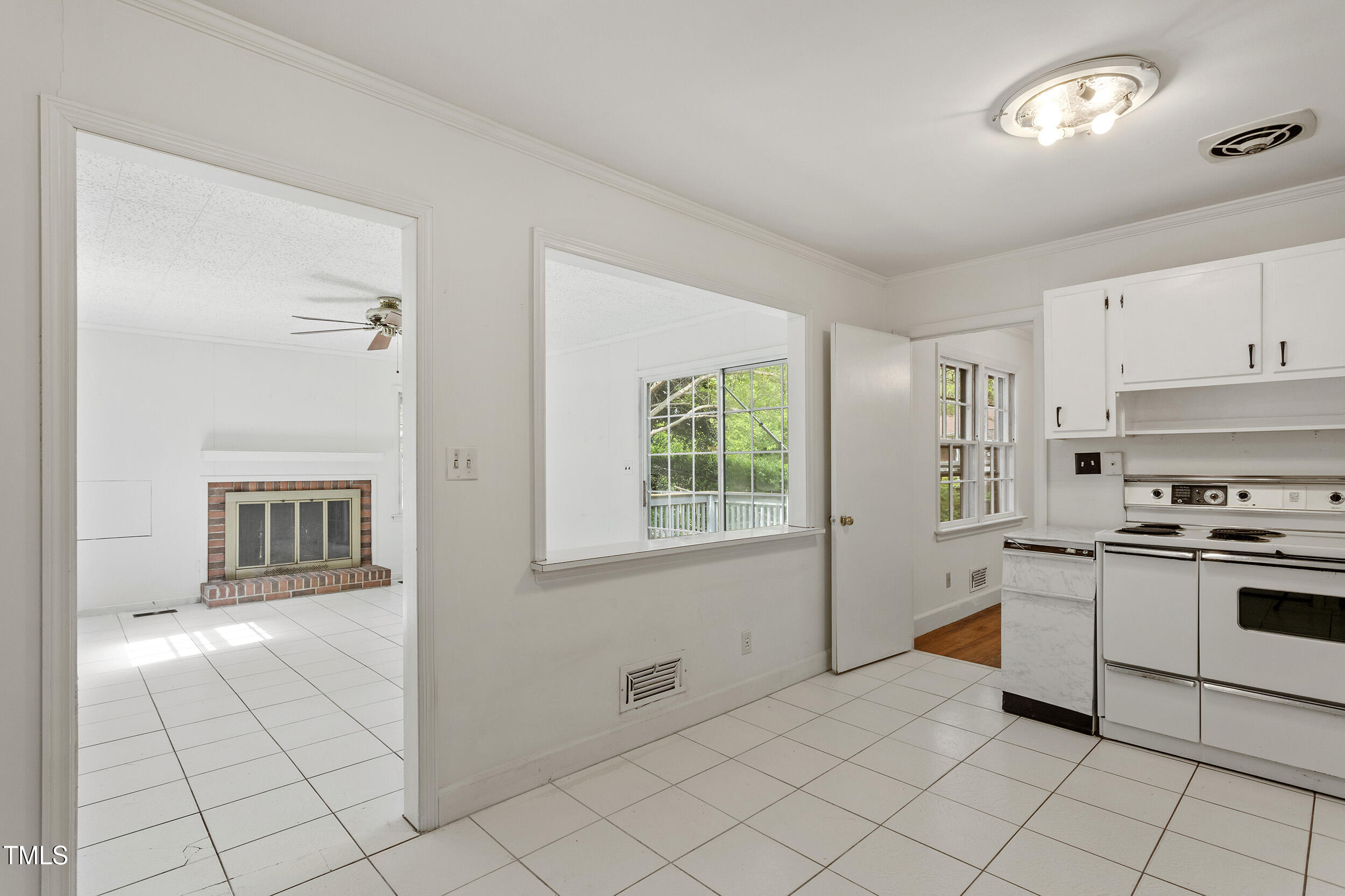 611 Beaver Dam Road Raleigh, NC 27607 - Photo 18 of 36 a kitchen with stainless steel appliances granite countertop a stove a sink and a refrigerator
